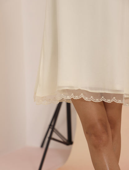 Lace Shift Dress - Cloud Dancer showing lace hem trim and fluid drape