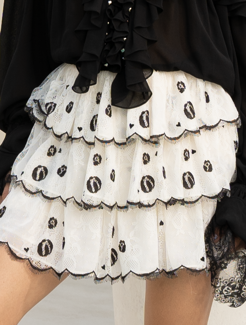 Ruffled skirt in off-white tulle with layered ruffles and heart motif detail
