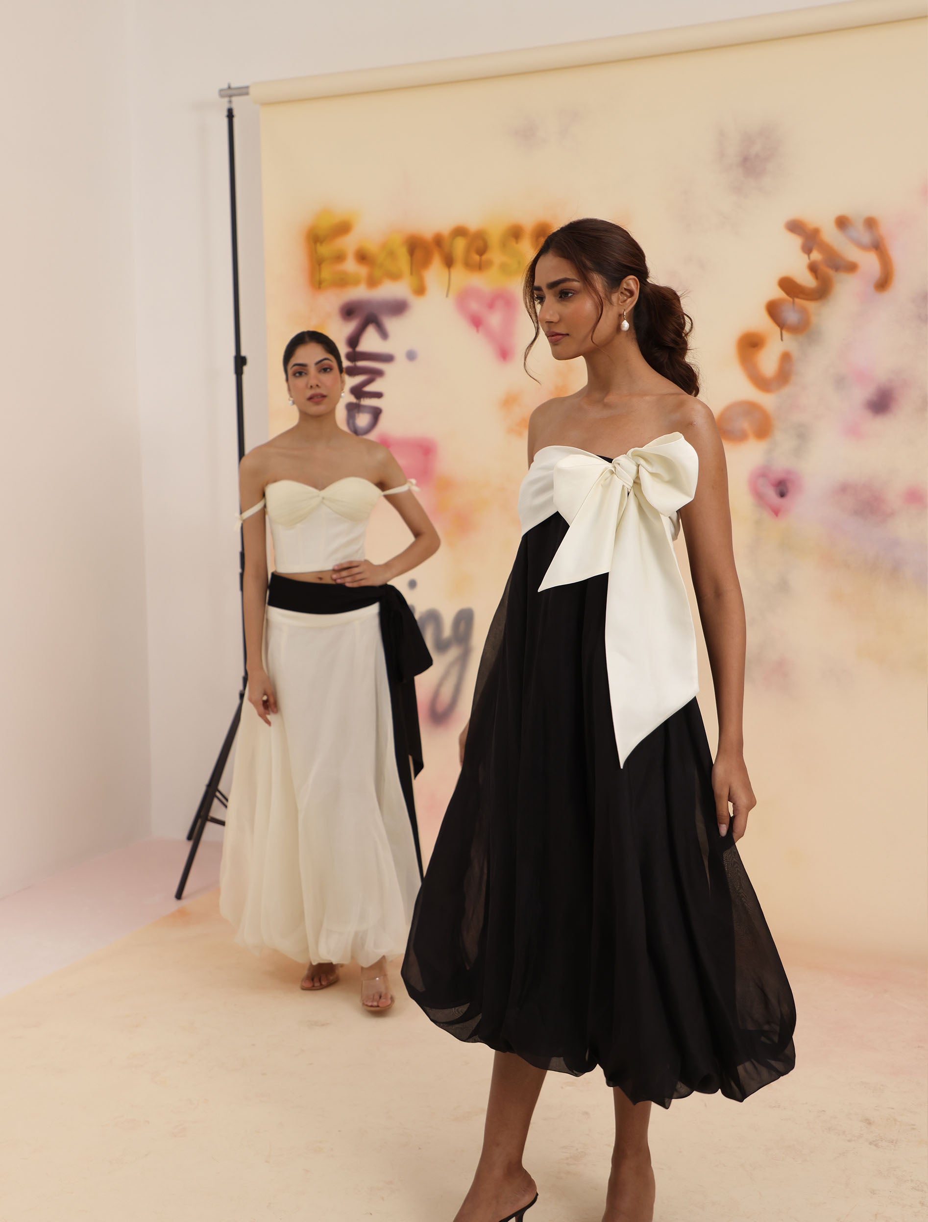 Cloud Hem Bow Skirt in black styled on runway with bubble hem