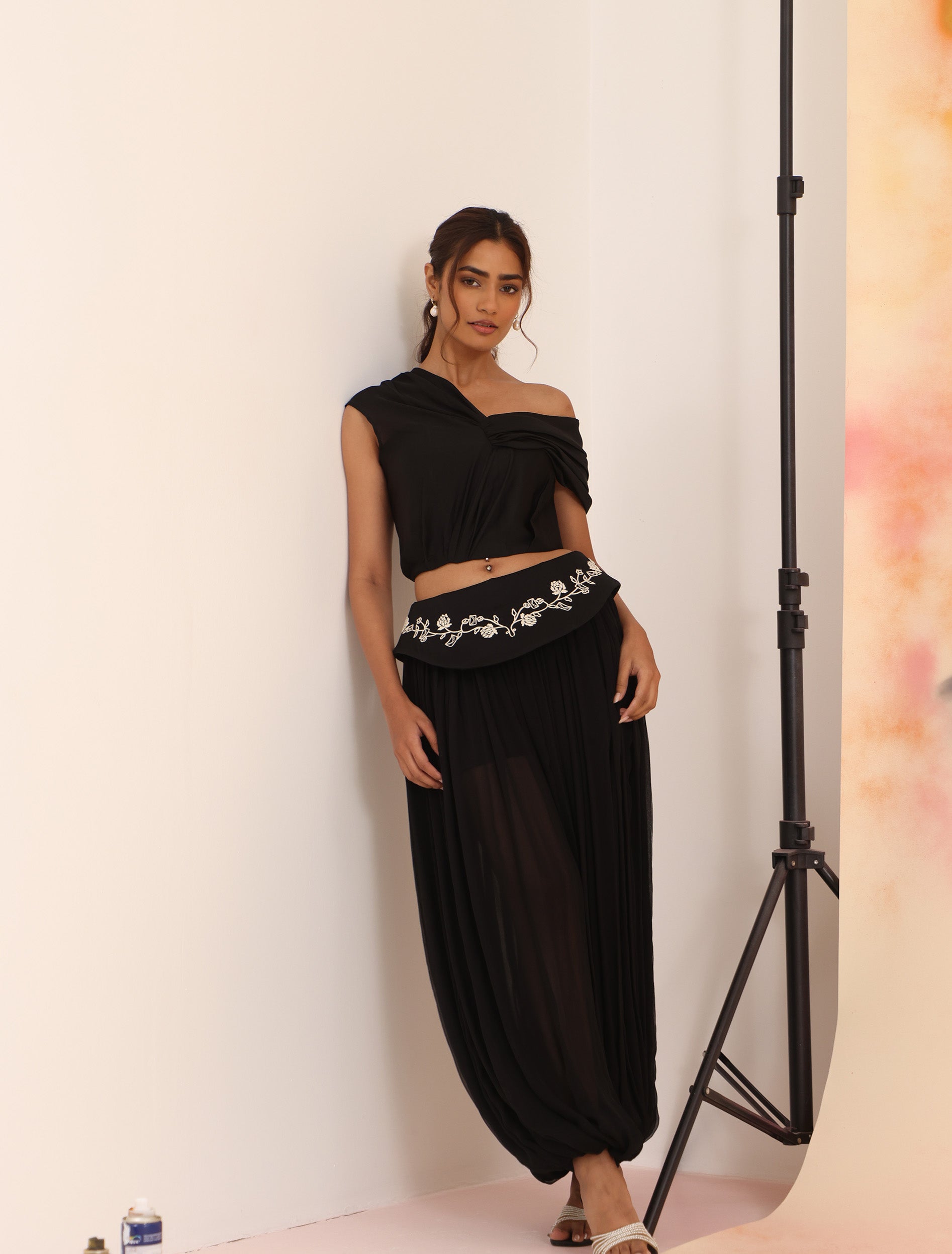Side view of black Sculpt Dhoti Pants with embroidered yoke detail