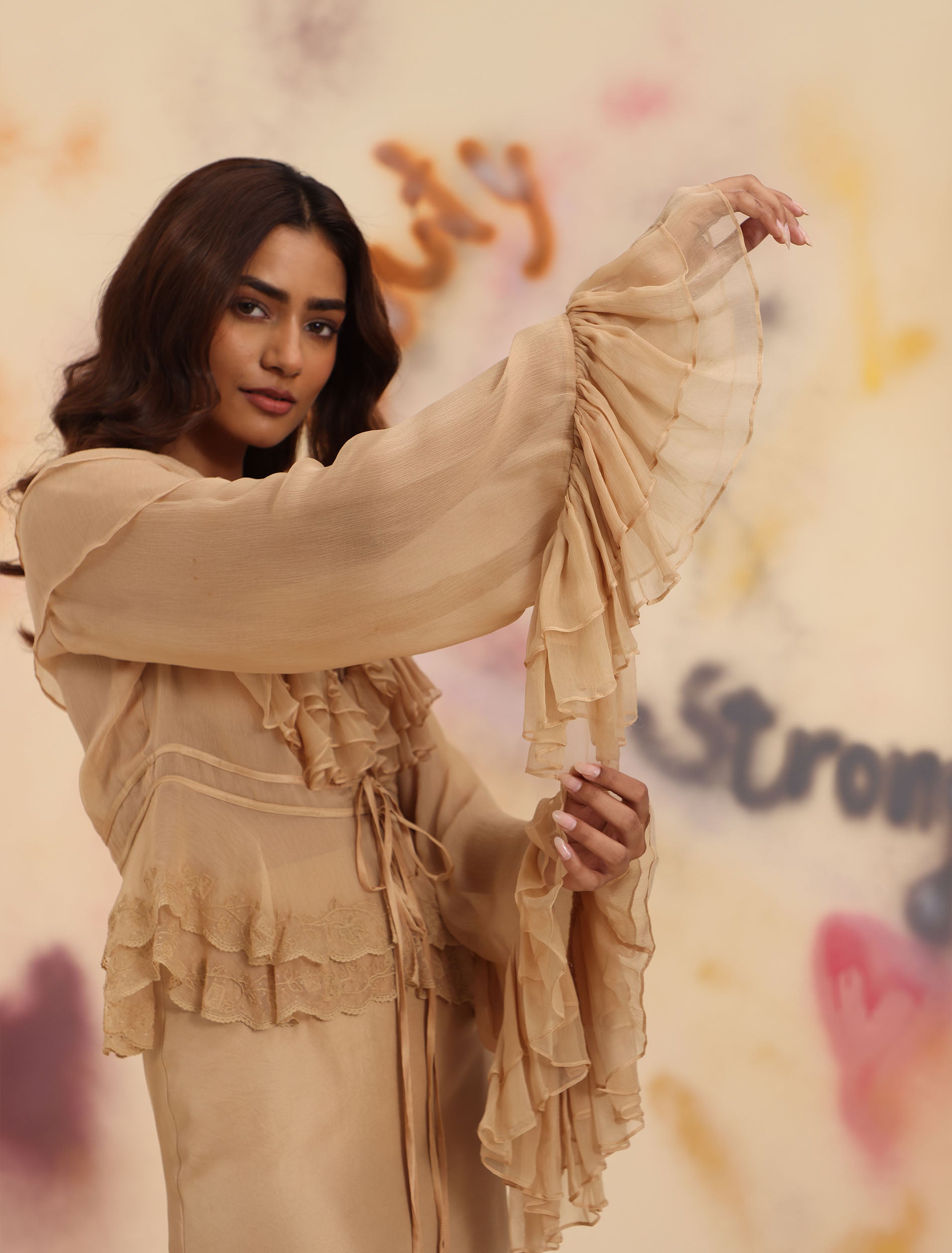 Sheer Ruffle Shirt in Toasted Almond showing ruffled bell sleeve and lace hem detail